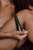 Load image into Gallery viewer, Person holding a green wand close to their body