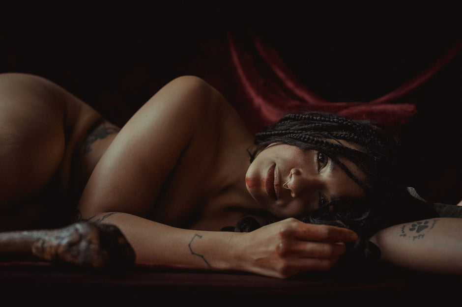 Person lying down with a dark background